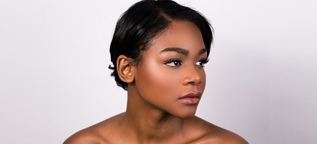 Young woman with dark, flawless skin